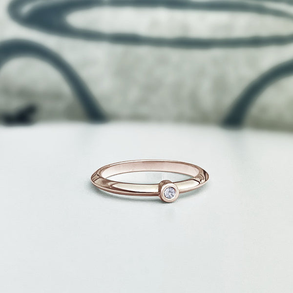 Diamond stacking ring in 14K solid rose gold. Knife edge style ring with bezel set diamond. Customize this ring!