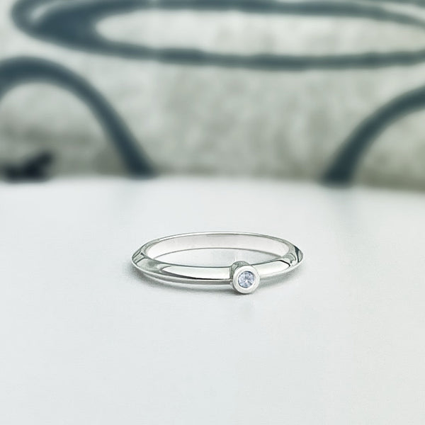 Solid white gold knife edge stacking ring with bezel set diamond. Customize this ring with a different gem!