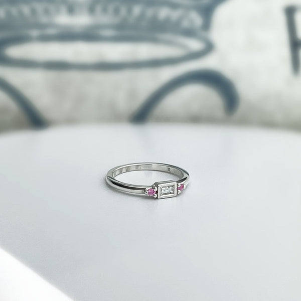 Baguette diamond stacking ring with pink sapphires, bezel set in sterling silver.