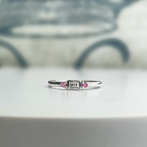 Diamond and pink sapphire stacking ring with a bezel set East/West baguette diamond. Solid sterling silver. Customize this ring!