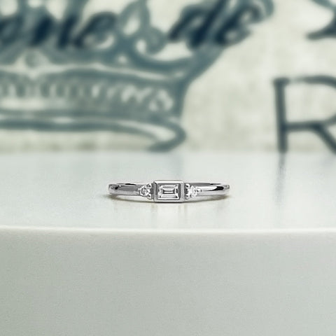 Baguette diamond ring, petite and dainty stacking ring in white gold.