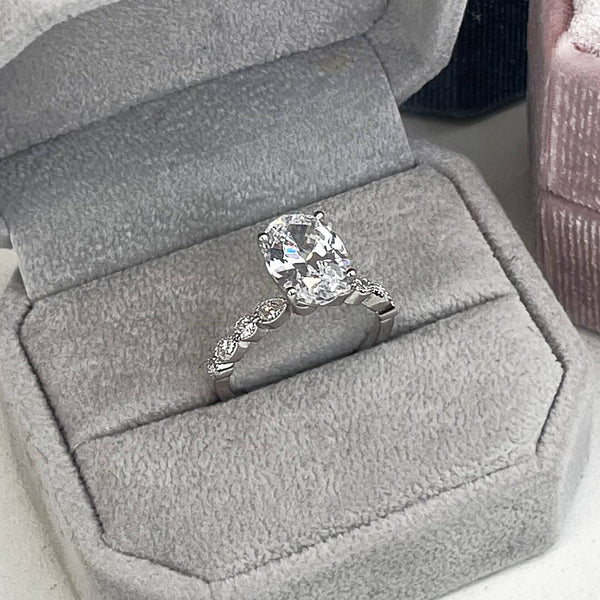 4ct oval diamond, white gold, small pear and round diamond accents, vintage, old money, engagement ring, wedding ring, bridal jewelery, proposals