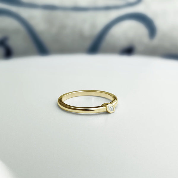 Solid gold marquise diamond ring in 14k yellow gold. Stacking ring with a natural diamond.