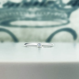 White gold knife edge diamond ring in solid 14k. Bezel set natural diamond in 2mm stacking ring.